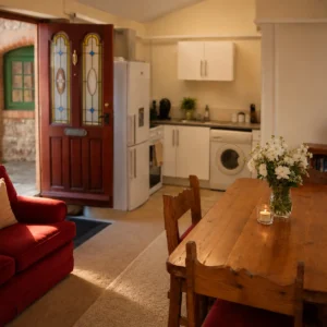 Cozy interior breakout room and kitchen at Bandpitt Barn, offering exclusive private venue hire in Somerset