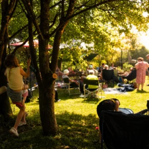 Guests relaxing in the sunny garden during a private daytime event and team building away day at Bandpitt Barn in Somerset
